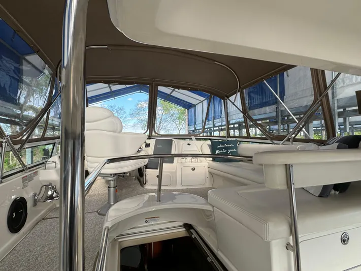 Fathom This Yacht Photos Pics 2001 Sea Ray 420 Aft Cabin interior with seating and helm under canopy.