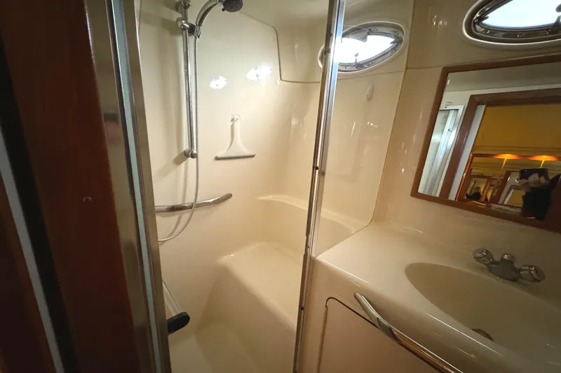 Fathom This Yacht Photos Pics Bathroom interior of 2001 Sea Ray 420 Aft Cabin yacht, featuring shower and sink.