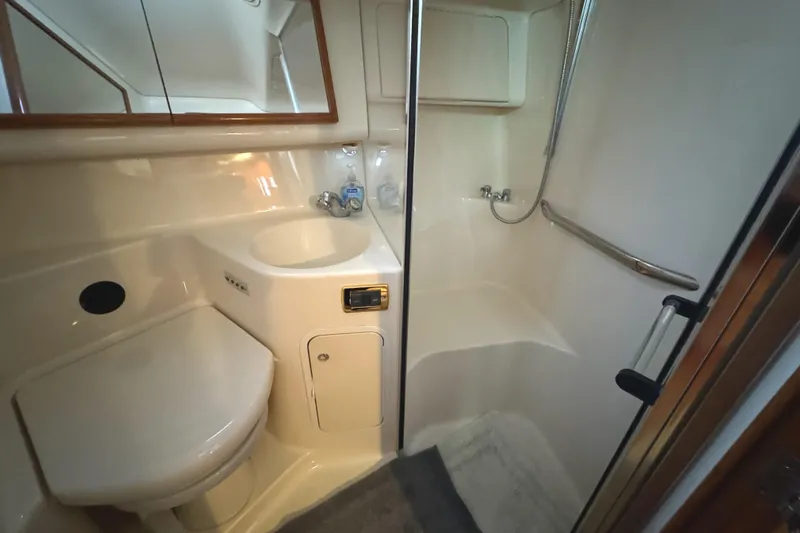 Fathom This Yacht Photos Pics 2001 Sea Ray 420 Aft Cabin bathroom with shower, sink, and toilet.