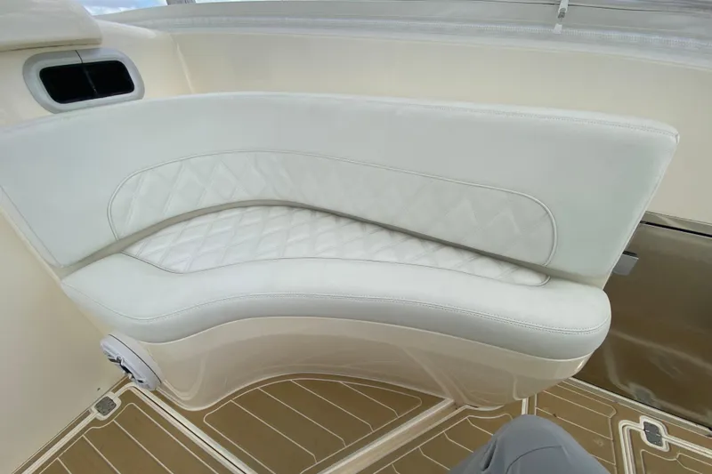  Yacht Photos Pics Luxurious seating on a 2006 Intrepid 377 boat with quilted white upholstery.