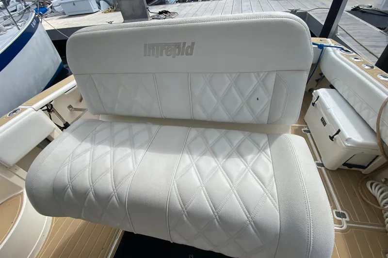  Yacht Photos Pics White leather seating on a 2006 Intrepid 377 boat, featuring diamond stitching.