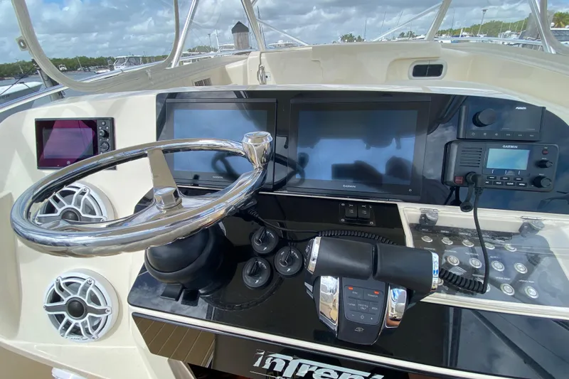  Yacht Photos Pics Helm of 2006 Intrepid 377 boat with modern navigation equipment and controls.