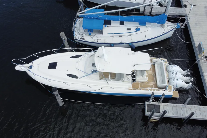  Yacht Photos Pics Aerial view of 2006 Intrepid 377 boat docked beside a sailboat.