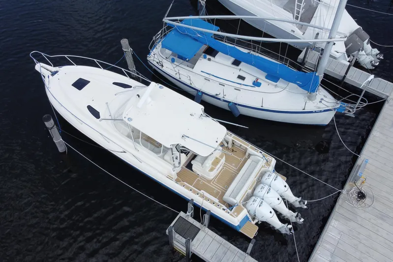  Yacht Photos Pics Aerial view of 2006 Intrepid 377 boat docked alongside a sailboat.