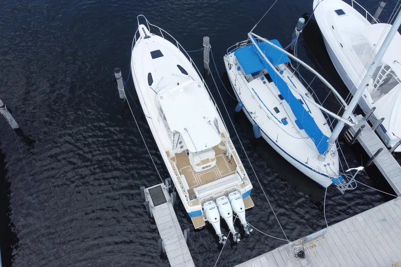  Yacht Photos Pics Aerial view of 2006 Intrepid 377 boat docked alongside sailboats.