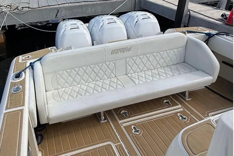  Yacht Photos Pics 2006 Intrepid 377 boat with white seating and triple outboard engines.