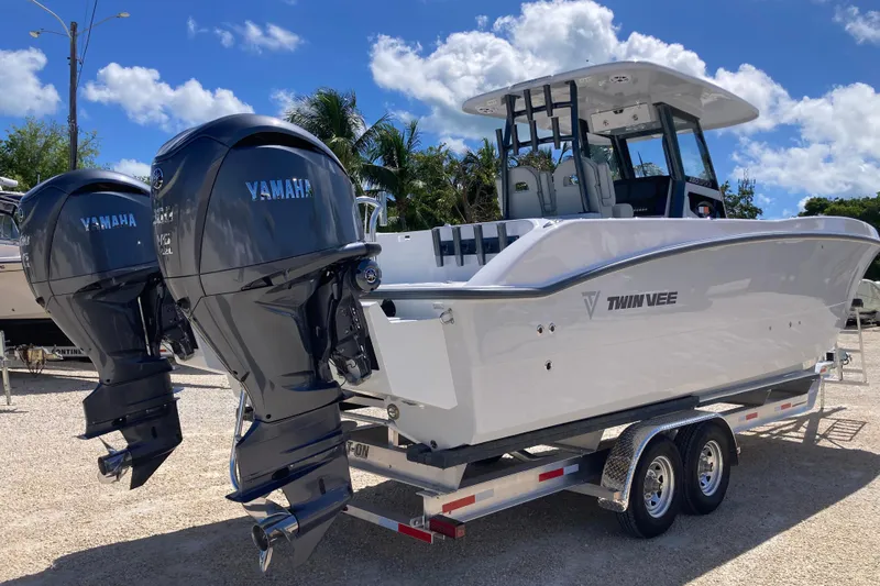 The Grey Ghost Yacht Photos Pics 2026 Twin Vee 280 GFX CC boat with dual Yamaha engines on a trailer.