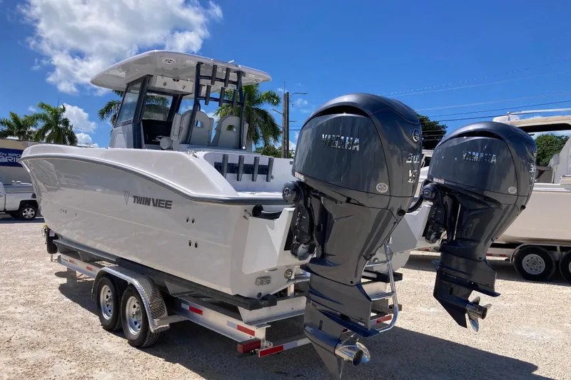 The Grey Ghost Yacht Photos Pics 2026 Twin Vee 280 GFX CC boat with dual Yamaha outboard engines on a trailer.