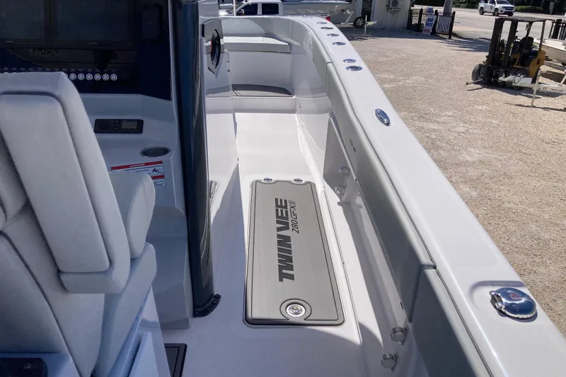 The Grey Ghost Yacht Photos Pics 2026 Twin Vee 280 GFX CC boat interior, featuring sleek design and modern controls.