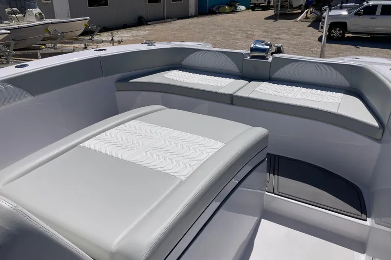 The Grey Ghost Yacht Photos Pics 2026 Twin Vee 280 GFX CC boat interior with cushioned seating and modern design.