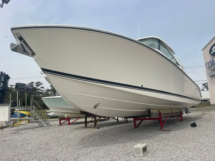  Yacht Photos Pics 2016 Pursuit DC 325 Dual Console on outdoor stands.