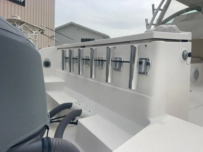  Yacht Photos Pics 2016 Pursuit DC 325 Dual Console with fishing rod holders.