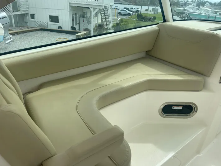  Yacht Photos Pics Interior of 2016 Pursuit DC 325 Dual Console with beige seating.