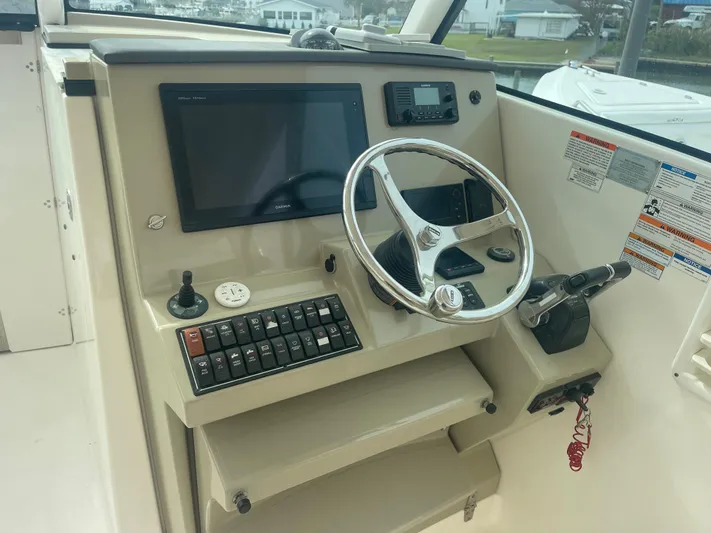  Yacht Photos Pics Helm of a 2016 Pursuit DC 325 Dual Console boat.