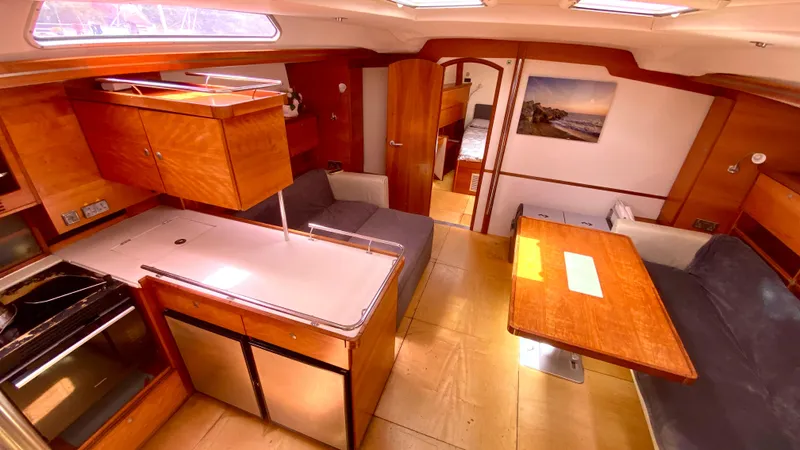  Yacht Photos Pics Interior of 2004 Hanse 531 yacht with modern kitchen and cozy seating area.