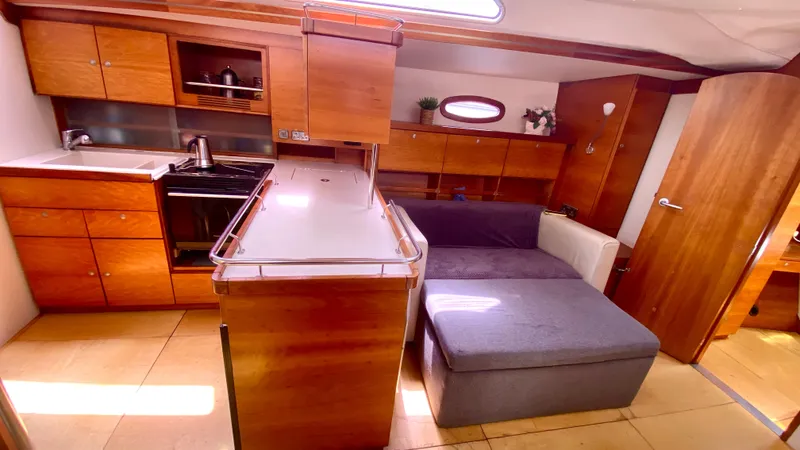  Yacht Photos Pics Interior of 2004 Hanse 531 yacht with modern kitchen and cozy seating area.