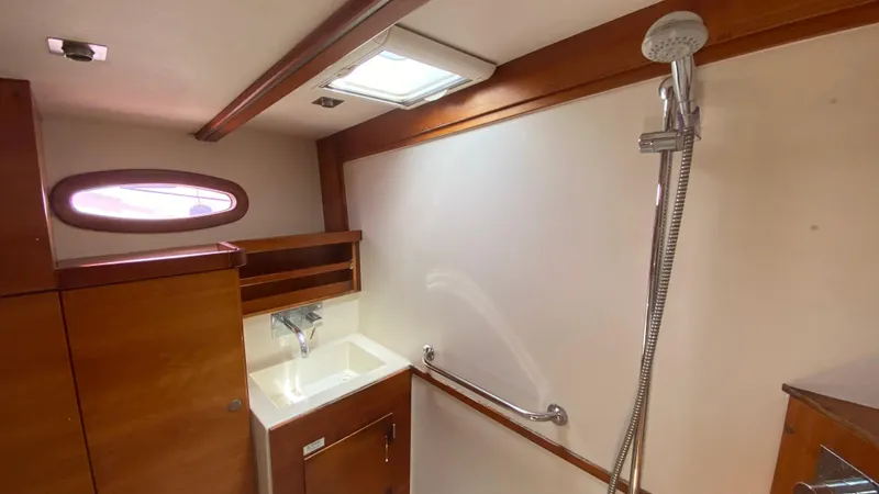  Yacht Photos Pics Interior of 2004 Hanse 531 yacht bathroom with sink and shower.
