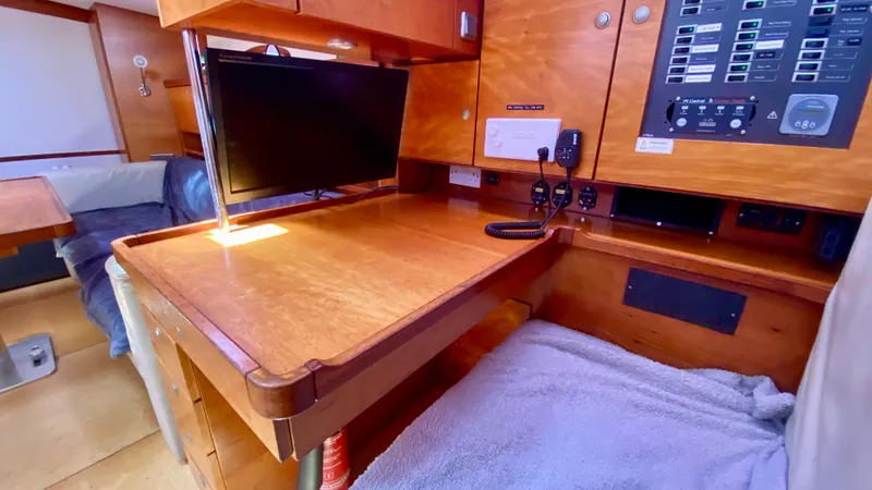  Yacht Photos Pics Navigation station in 2004 Hanse 531 yacht with control panel and monitor.