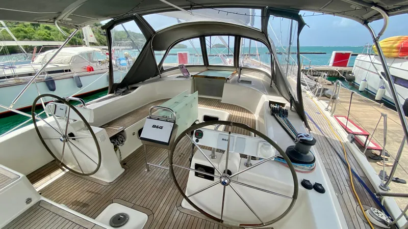  Yacht Photos Pics Hanse 531 sailboat cockpit, 2004 model, featuring dual steering wheels and spacious seating.