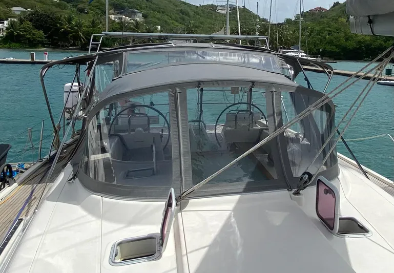  Yacht Photos Pics 2004 Hanse 531 sailboat with dual steering wheels, docked in a scenic marina.