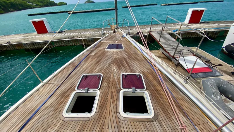  Yacht Photos Pics Deck view of 2004 Hanse 531 yacht docked at a marina with turquoise waters.