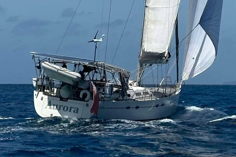  Yacht Photos Pics Sailing yacht Hanse 531, 2004 model, navigating ocean waters with full sails.