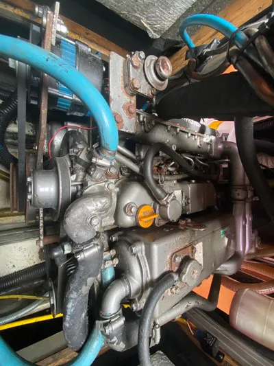  Yacht Photos Pics Engine of a 2004 Hanse 531 sailboat with visible hoses and components.