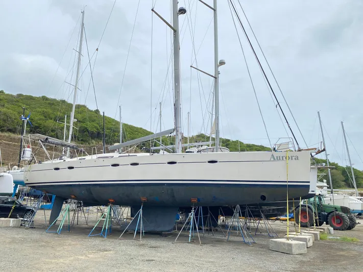  Yacht Photos Pics 2004 Hanse 531 sailboat on stands in a boatyard, overcast sky.
