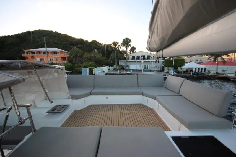 Ruckus Yacht Photos Pics Fountaine Pajot Catamaran Elba 45, 2021 model, featuring spacious outdoor seating area.