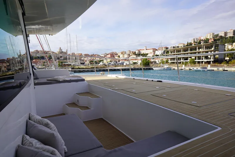 Melissa Yacht Photos Pics Luxurious 2022 Silent 60 yacht deck with scenic coastal view.