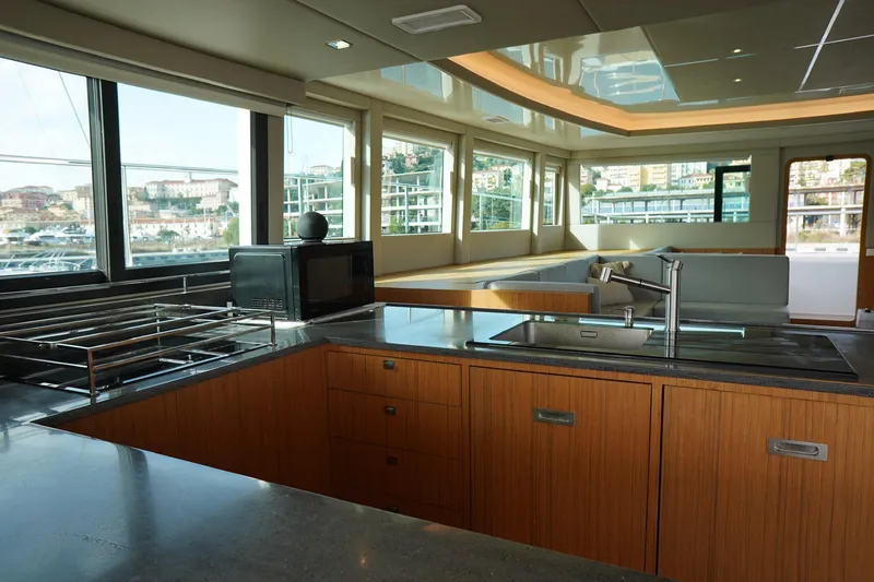 Melissa Yacht Photos Pics Luxurious interior of 2022 Silent 60 yacht with modern kitchen and panoramic windows.