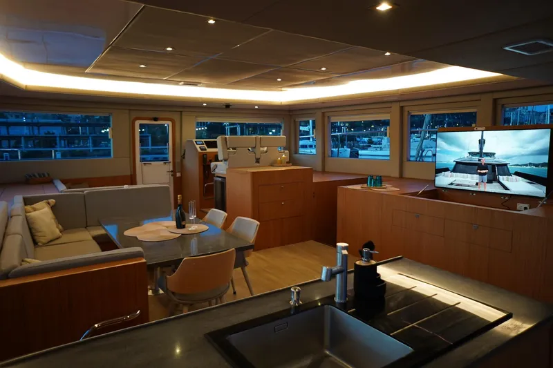 Melissa Yacht Photos Pics Luxurious interior of 2022 Silent 60 yacht with modern furnishings and large windows.