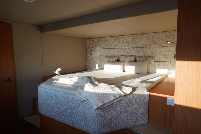 Melissa Yacht Photos Pics Luxurious bedroom interior on 2022 Silent 60 yacht, featuring elegant bedding and modern design.