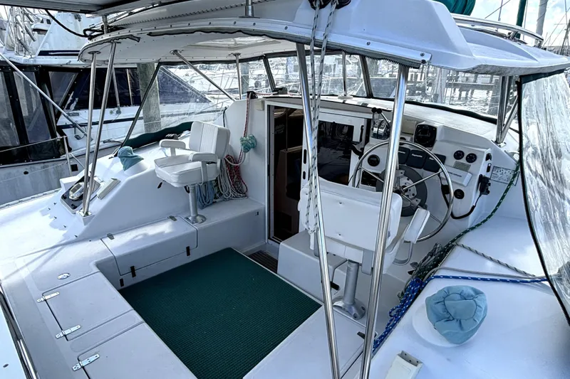 Serenity Yacht Photos Pics 2003 PDQ 36 Capella yacht cockpit with steering wheel and seating area.