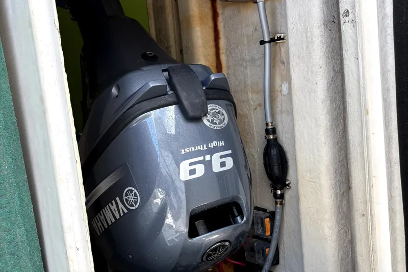 Serenity Yacht Photos Pics Outboard motor in a 2003 PDQ 36 Capella boat compartment.