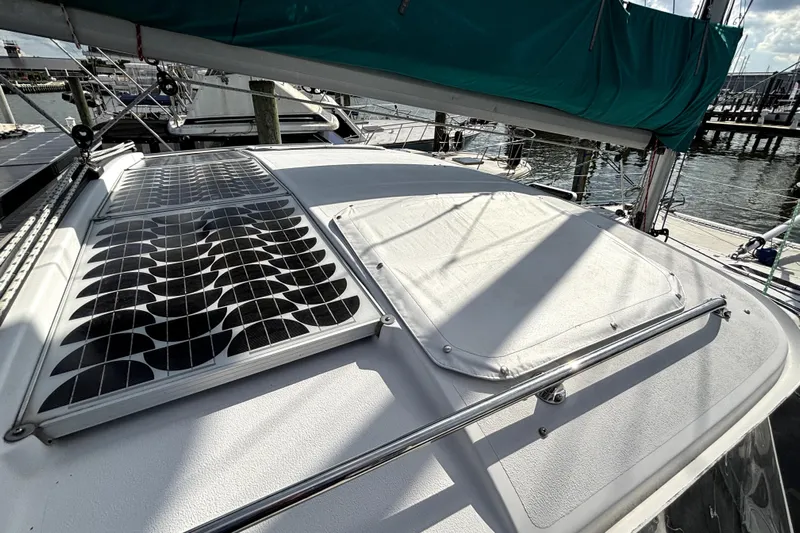 Serenity Yacht Photos Pics 2003 PDQ 36 Capella sailboat with solar panels on deck, docked at marina.