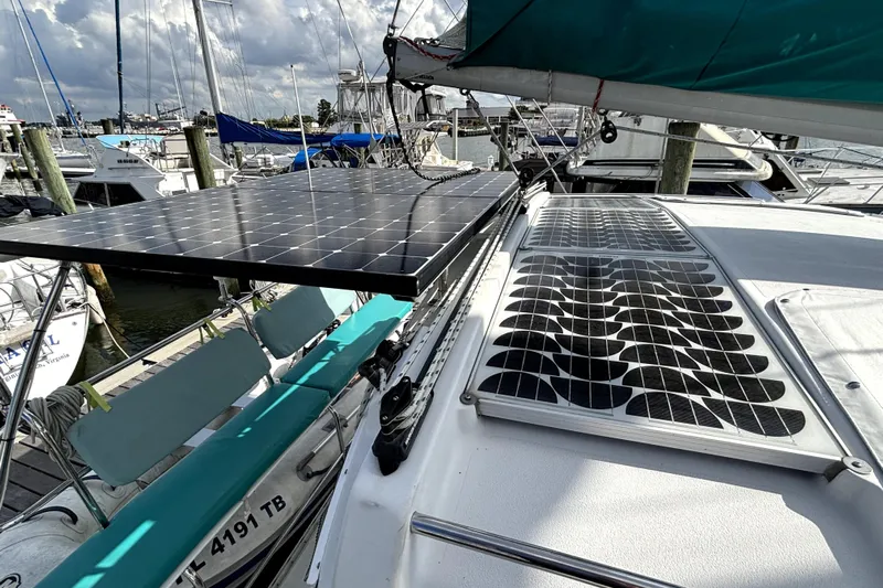 Serenity Yacht Photos Pics 2003 PDQ 36 Capella sailboat with solar panels docked at a marina.