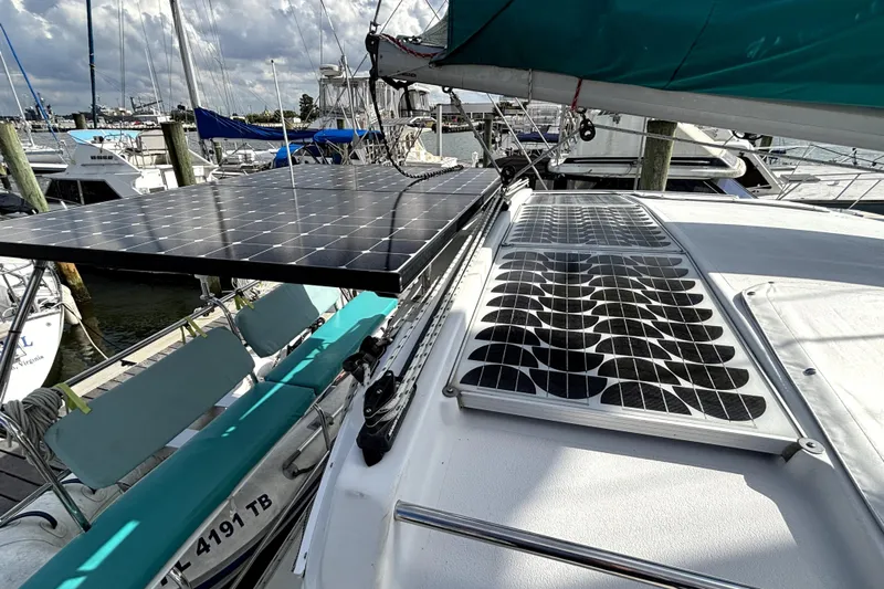 Serenity Yacht Photos Pics 2003 PDQ 36 Capella sailboat with solar panels docked at a marina.