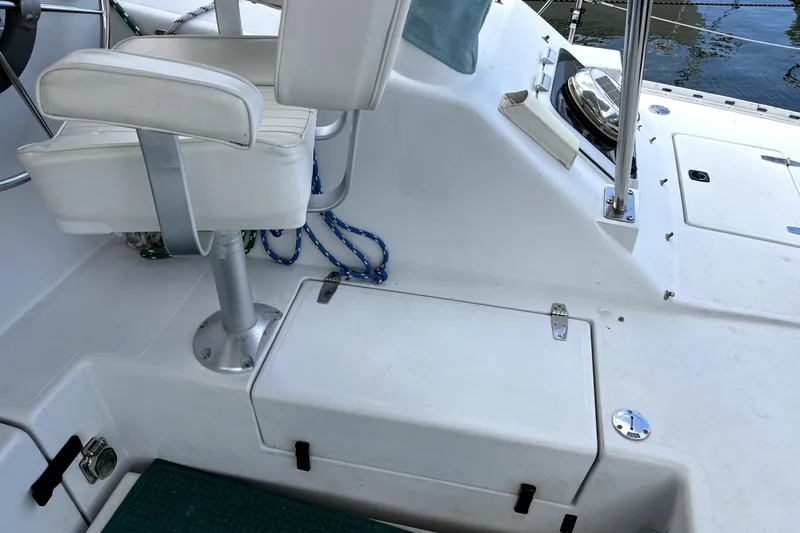 Serenity Yacht Photos Pics 2003 PDQ 36 Capella boat cockpit with white seating and storage compartments.