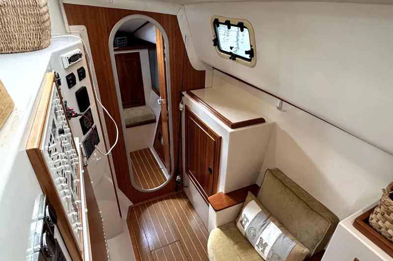 Serenity Yacht Photos Pics Interior of 2003 PDQ 36 Capella yacht with wood accents and cozy seating.