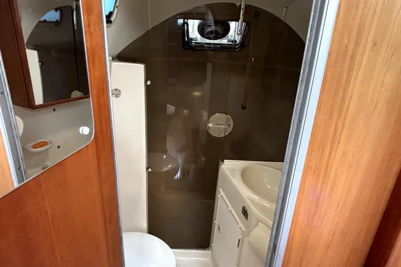 Serenity Yacht Photos Pics Bathroom interior of 2003 PDQ 36 Capella boat with shower and sink.
