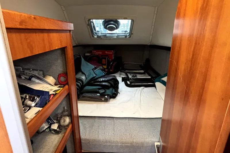 Serenity Yacht Photos Pics Interior cabin of 2003 PDQ 36 Capella with storage shelves and window.