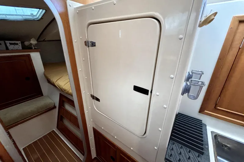 Serenity Yacht Photos Pics Interior of 2003 PDQ 36 Capella yacht showing cabin and storage areas.