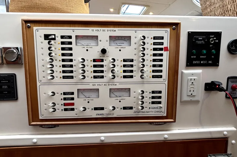Serenity Yacht Photos Pics Electrical control panel on a 2003 PDQ 36 Capella boat, featuring DC and AC systems.