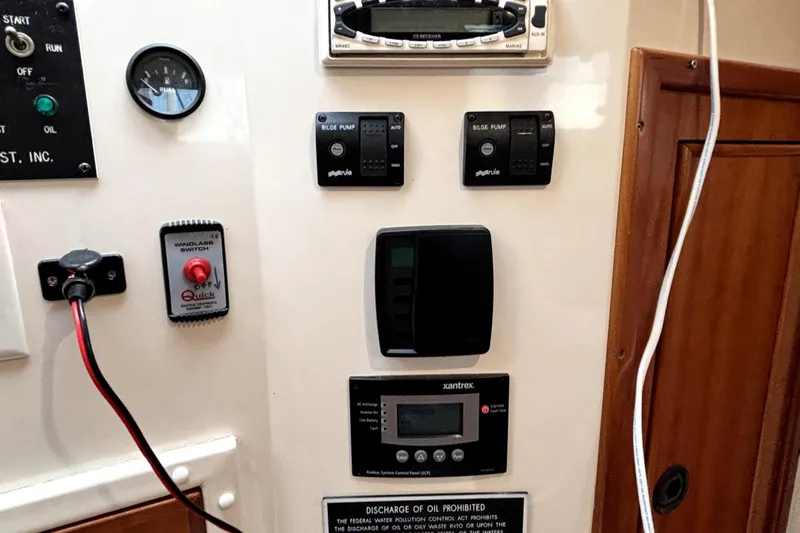 Serenity Yacht Photos Pics Control panel of a 2003 PDQ 36 Capella boat with various switches and gauges.