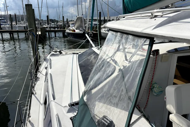 Serenity Yacht Photos Pics 2003 PDQ 36 Capella sailboat docked at marina, featuring deck and cockpit view.