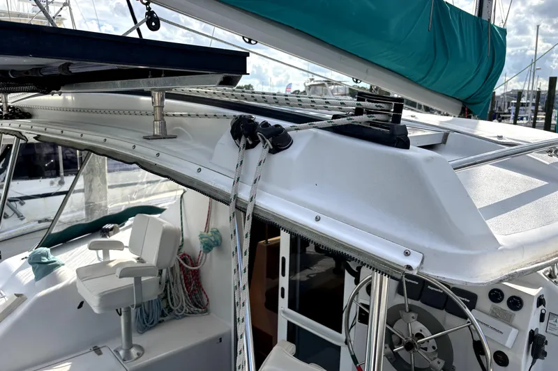 Serenity Yacht Photos Pics 2003 PDQ 36 Capella sailboat cockpit with ropes, steering wheel, and seating.