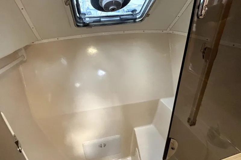 Serenity Yacht Photos Pics Interior of 2003 PDQ 36 Capella boat, featuring a compact, well-lit cabin space.