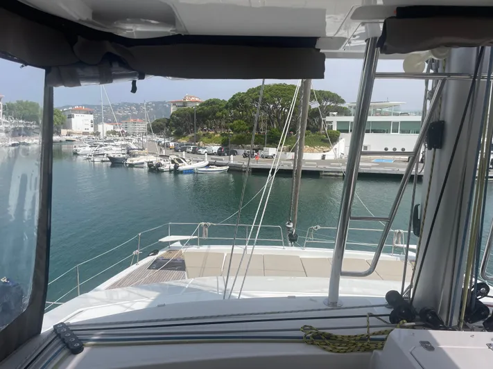  Yacht Photos Pics View from Bali 5.4 yacht, 2023 model, overlooking marina with boats and modern buildings.