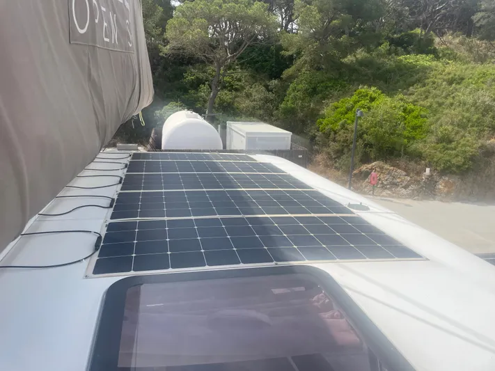  Yacht Photos Pics Solar panels on a 2023 Bali 5.4 catamaran, surrounded by lush greenery.